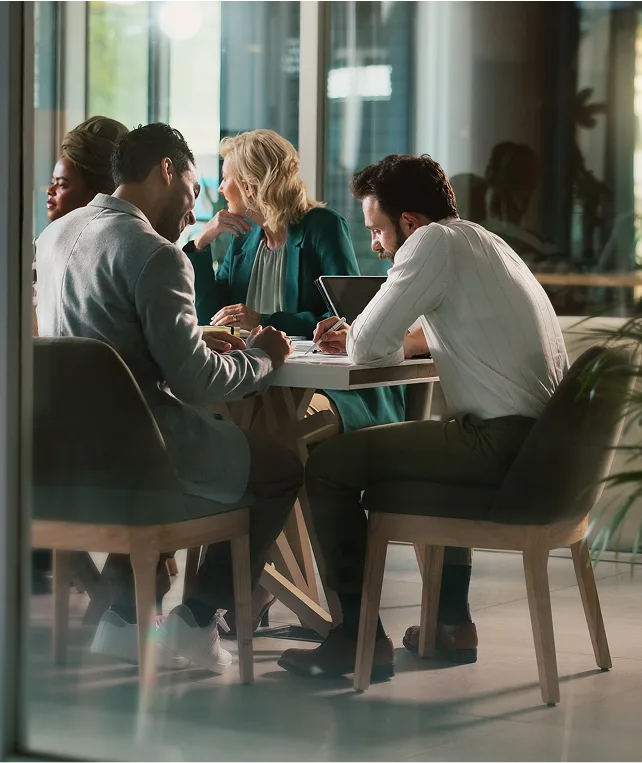Business partners working together after a presentation
