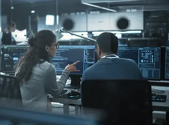 Security operations center team monitoring dashboards.